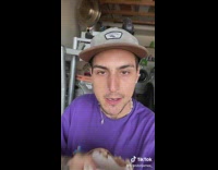 Guy eating coconut shows off nails 