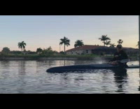 man slow motion blue kayak