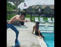 guy in blue mermaid costume pool