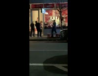 three guys outside restaurant fire in hands