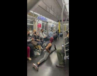 Guy wearing spiderman mask does splits and flips on subway 