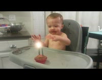 Baby use whisk to put out birthday candle