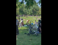 Guy in rat costume jumps at park 