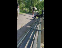 Woman dance wave pastel colored flags park