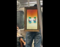 Collab Subway Creatures - Man wear frame tv that displays advertisement