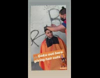 Black face mask guy haircuts outside graffiti 