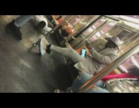 Guy does push ups on subway suit 