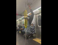 Upsidedown Commuter does a tap dance on the ceiling of subway car