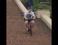Guy rides bicycle down stairs fail ucla 