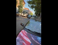 Truck driver keeps honking at double parked car