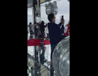 Woman red dress room with silver balloons