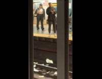 Woman tears paper throws in railway track