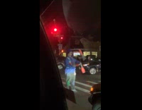 Man juggles pins in middle of road