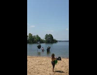 Woman dress photo shoot crew reflector beach 