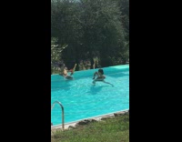 Guy sunglasses pool drink orange water gun