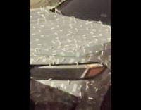 Car full of Christmas lights attached with tape