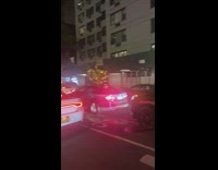 Car window gold foil number balloons traffic