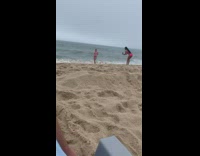Two women in pink bikini take turns at the beach Part 1