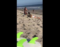 Woman lie down eat food photo shoot beach