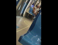 Guy files toenails on subway train 