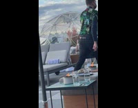 Woman in white top poses inside a tent