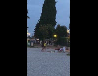 Two women tiktok dance beach garbage bin