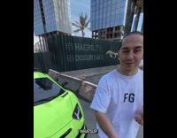 Virtual concrete block crushes green sports car