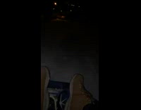 guy records himself on sled brown boots
