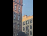 Man Dances Along with Music on Top of Establishment