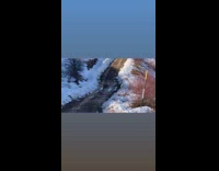 Husky dog run towards filmer mountain windmill