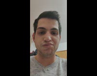 Man with paralyzed face opens his mouth