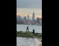 Emo guy lip sings for music video on rocks 