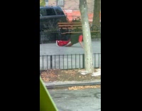 Man works out push ups on sidewalk 