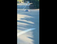 Girl falls while running down street