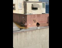 Woman in white dress poses at the balcony Part 2
