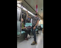 man juggling pink pin on mouth train