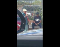 Woman shouts at street talks using megaphone