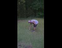 Guy lays mouse on grass for bird