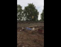 construction worker jumps on a plank and sends bucket flying
