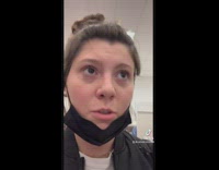 GIrl with fingers stuck in red target shopping basket 