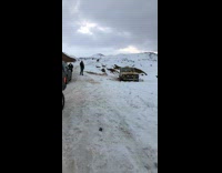 Truck tries to pull stuck car out of ditch with ratchet tie, tie snaps