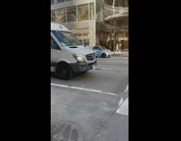 Van with flat tire drives down street