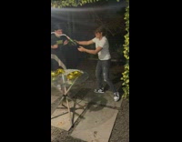 Lady opens champagne and gets wet 