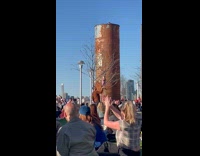 Collab WINY - Crowd Cheers as Man Holds Up Baby