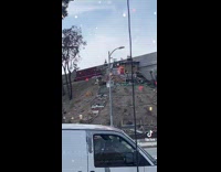 Homeless encampment on hill by street 