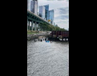 Man on blue floaty use flippers as paddles