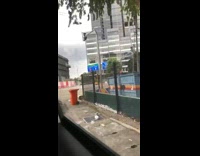 Guy throws trash bag garbage falls out