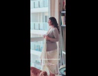 Woman gray coat dress photo shoot apartment