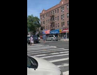 Blue shirt guy directs traffic busy intersection 