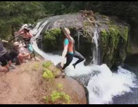 Woman backflips into waterfall pool after friends countdown 